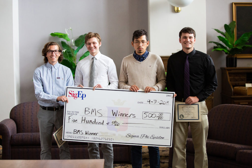 2019 Balanced Man Scholarship Winners holding their check given by SIgEp UNI